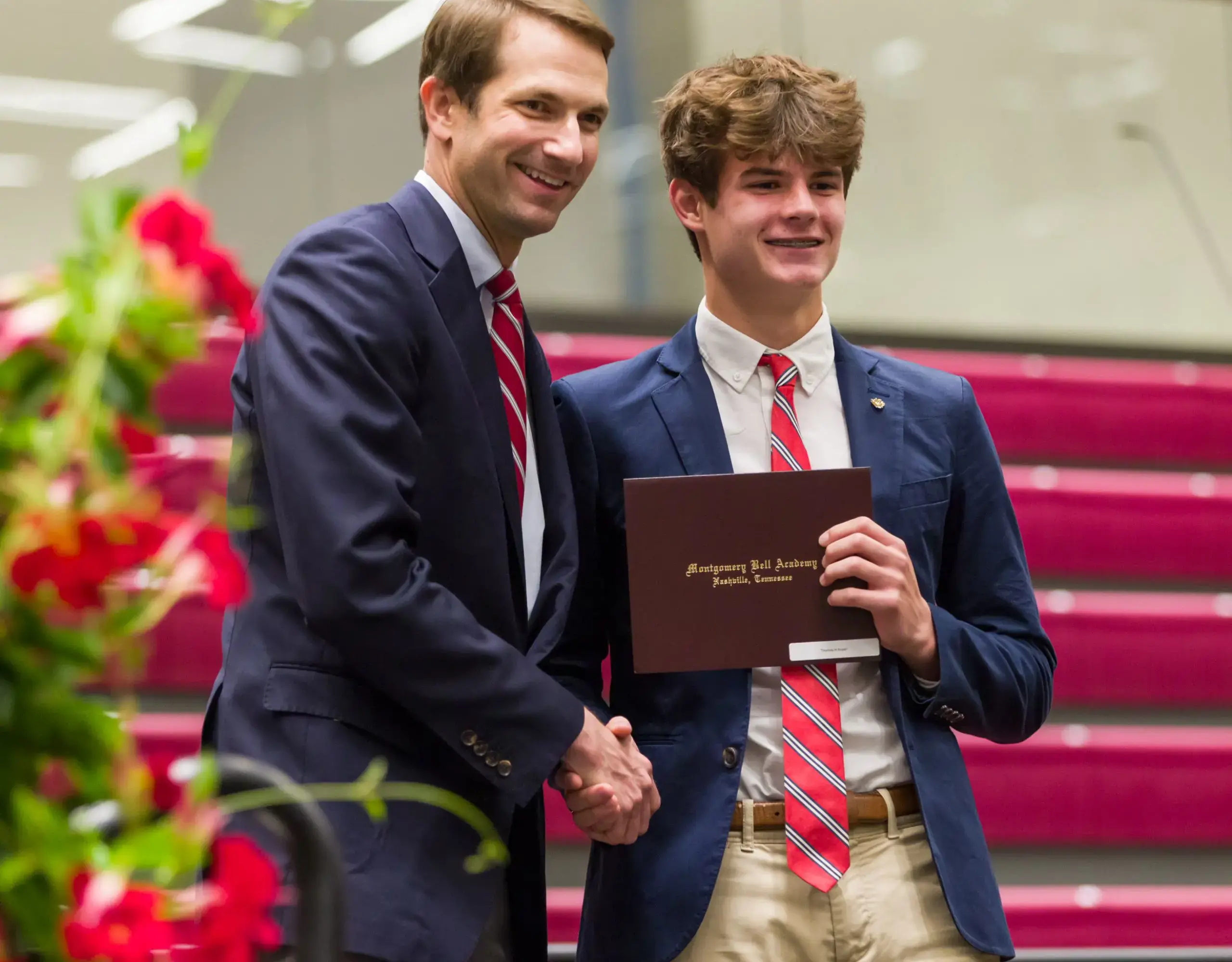 Teacher giving student award