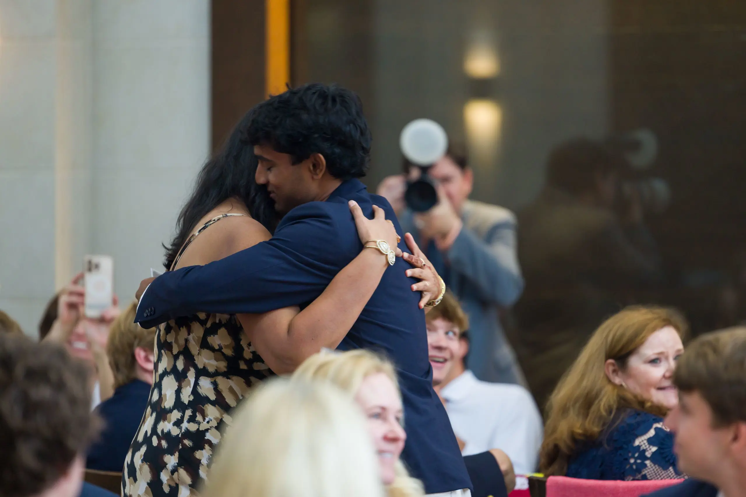 Parent and student hugging