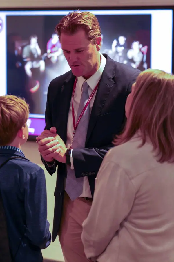 Staff talking to child and parent