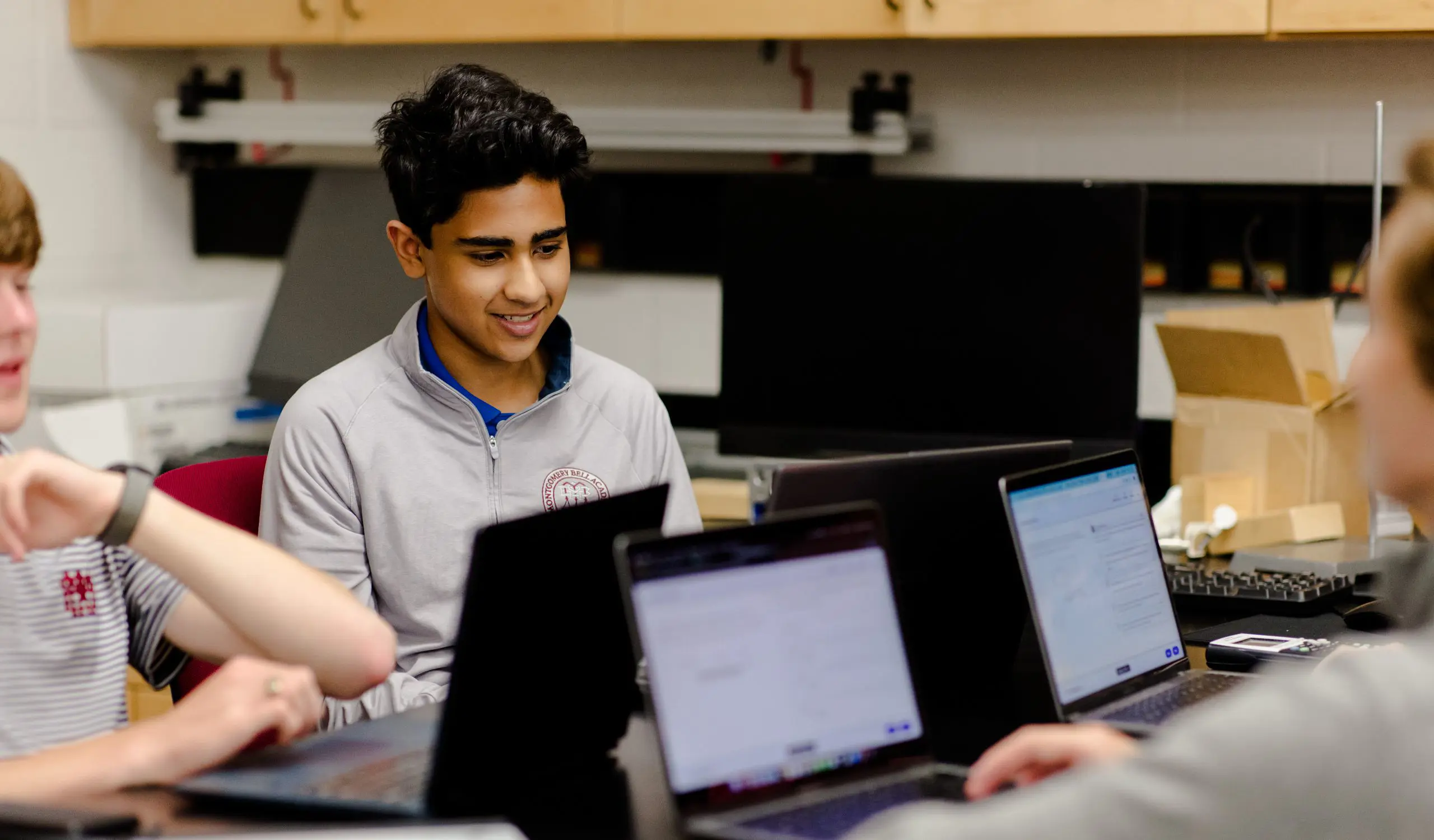 Young boy looking at computer