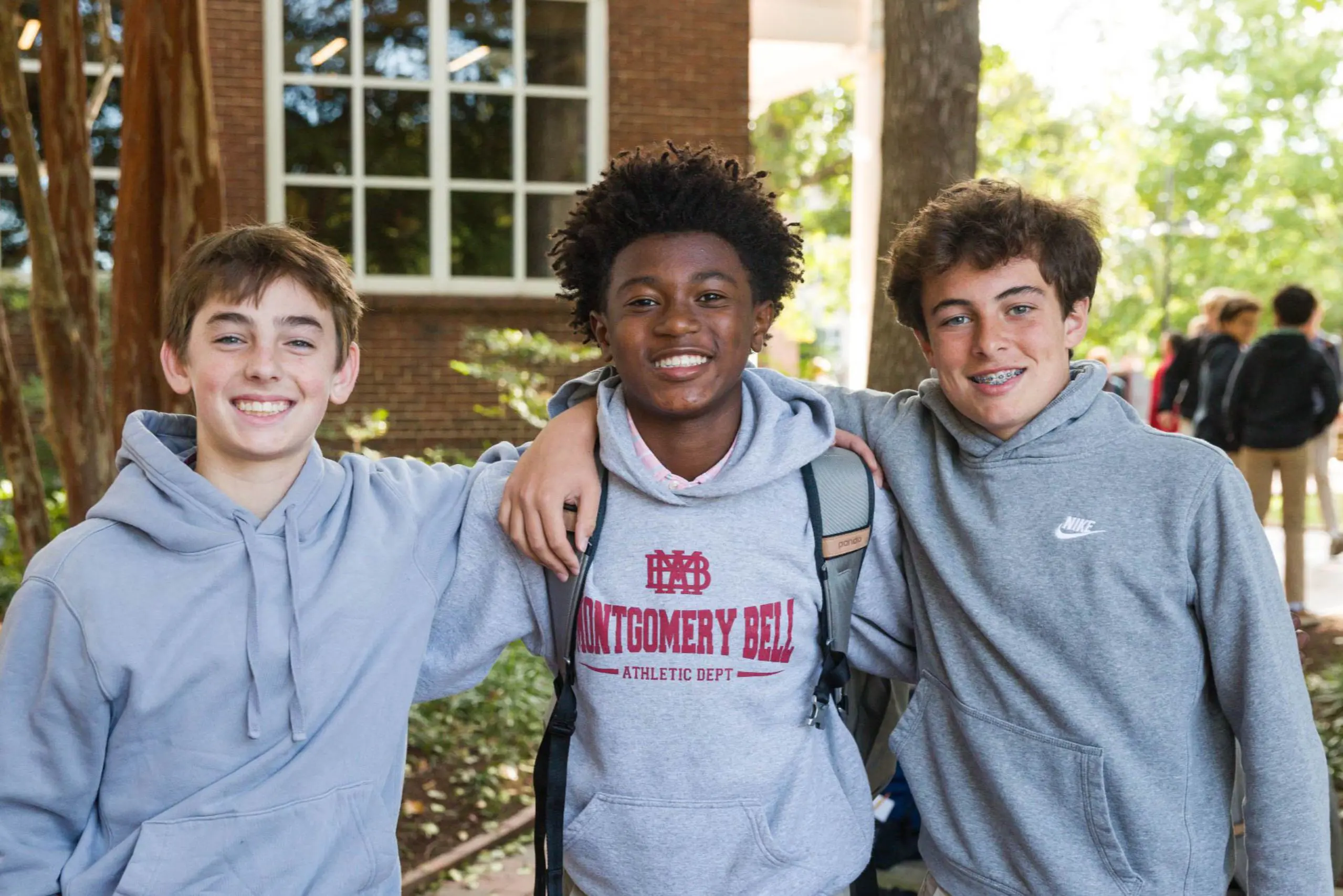 Three friends with Montgomery school hoodies