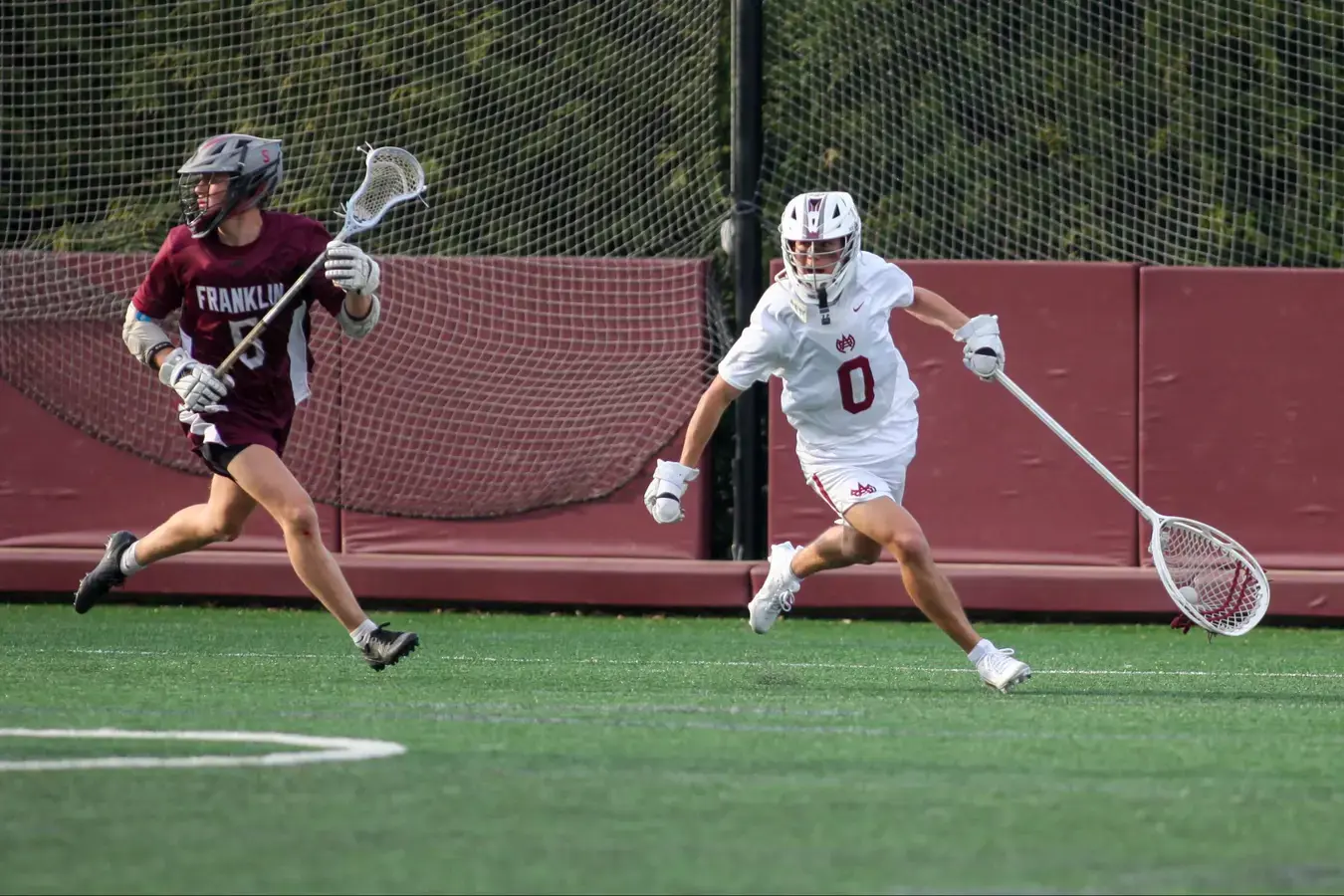 Lacrosse players running