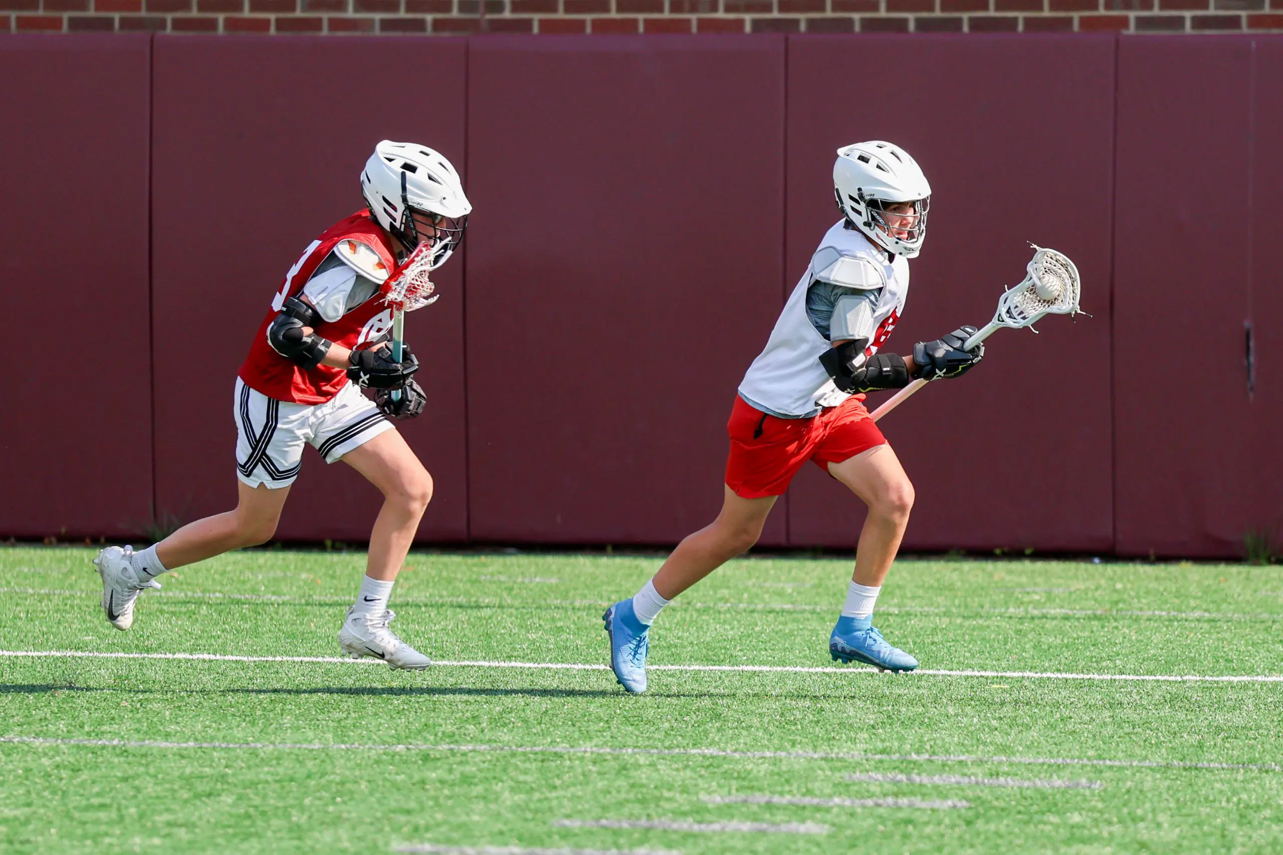 Lacrosse players on field