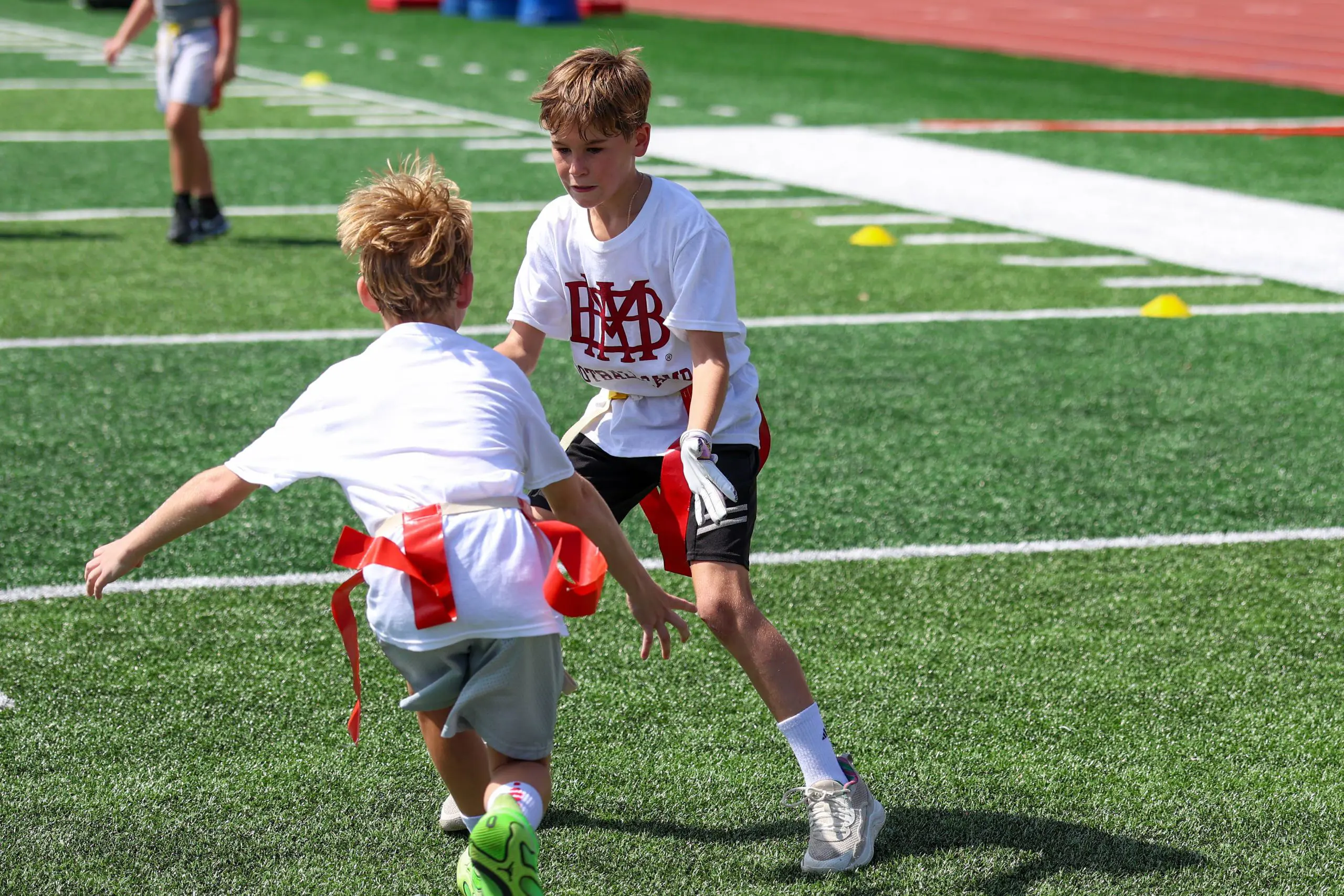 Two kids playing football