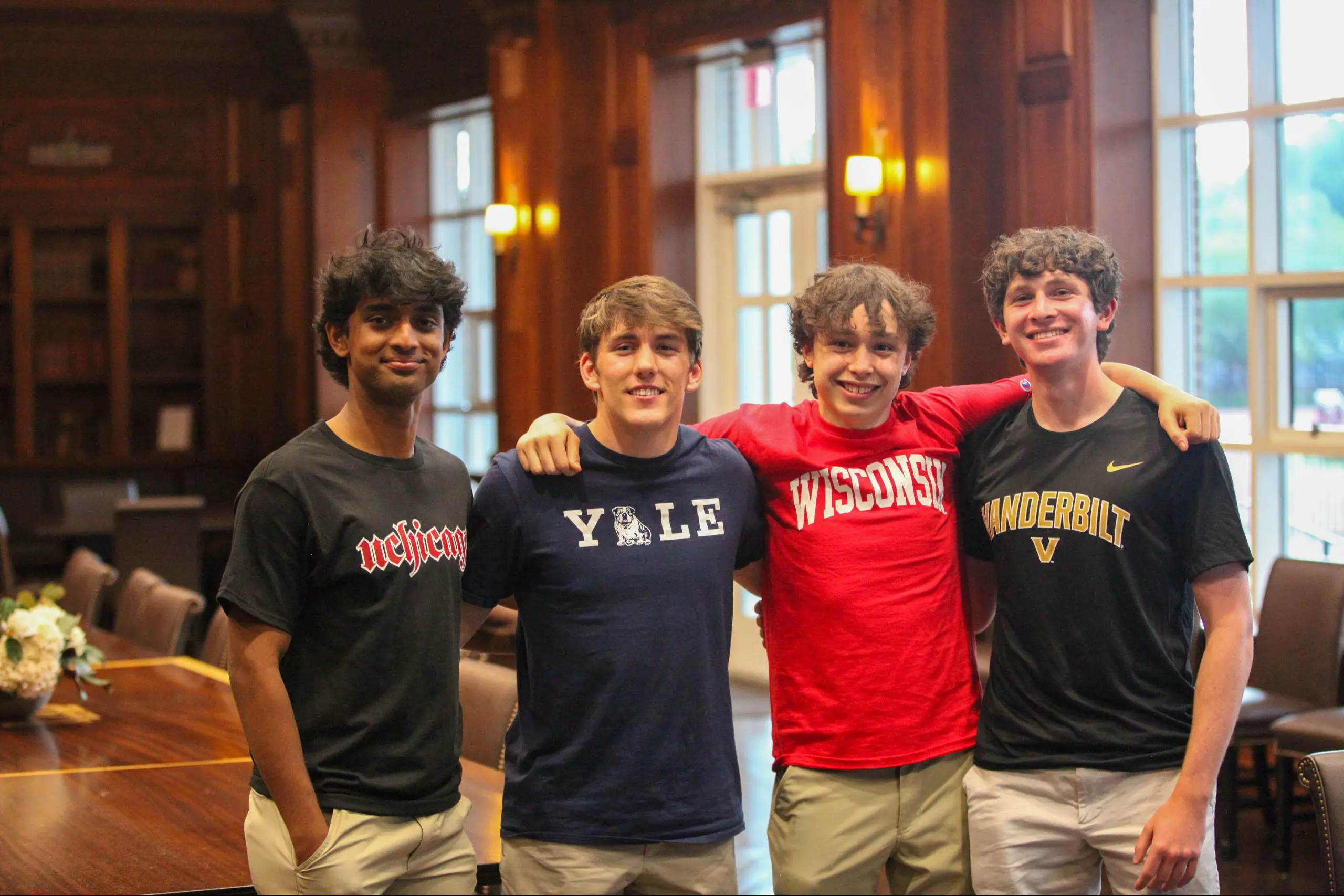 Students wearing different school shirts
