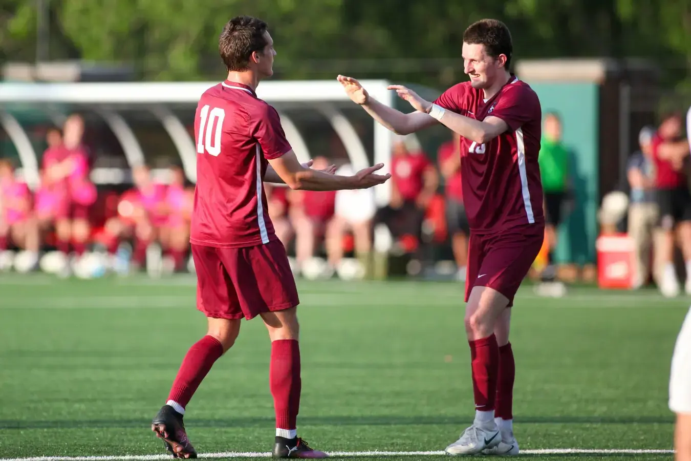 Soccer players high fiving