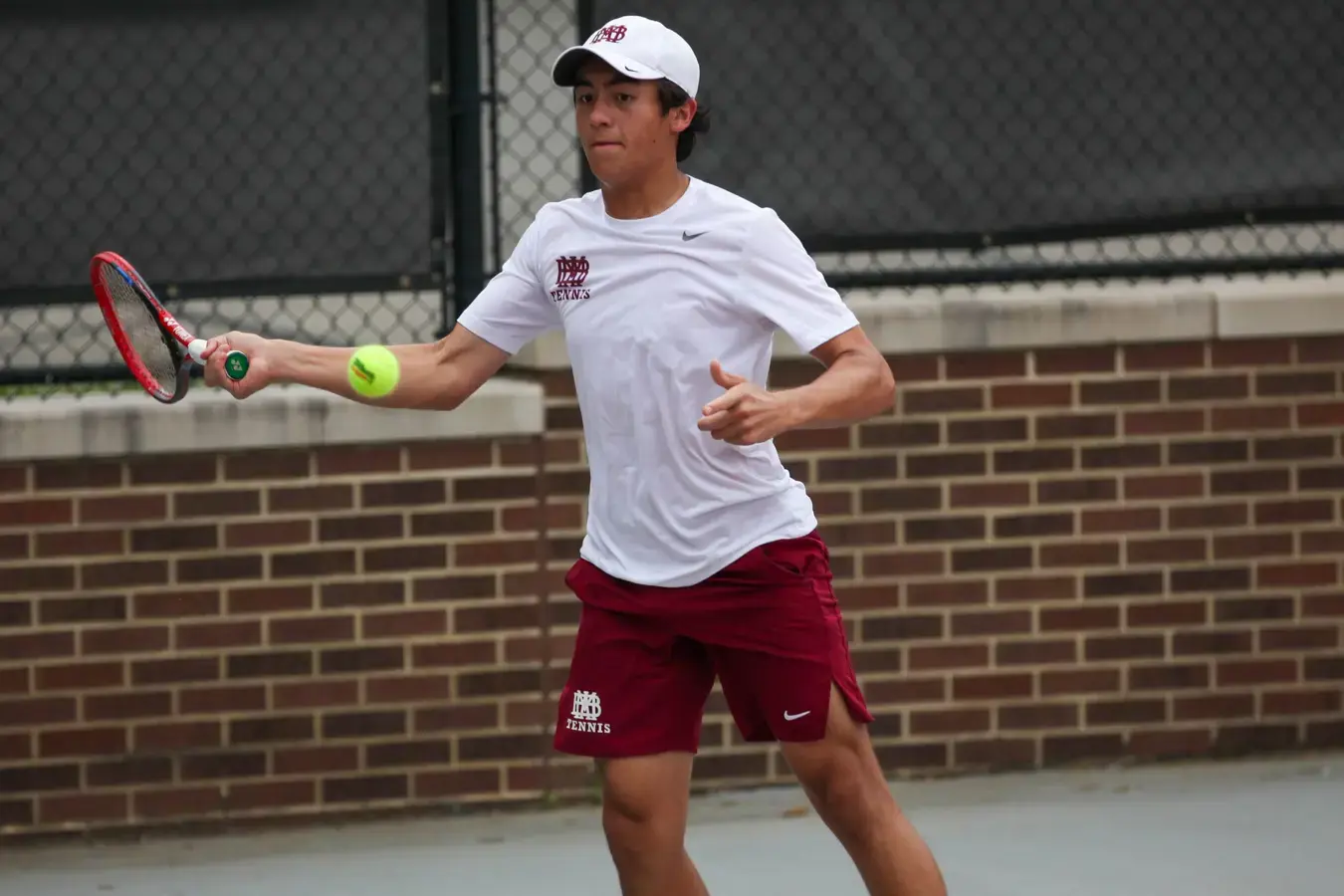 Tennis player hitting ball