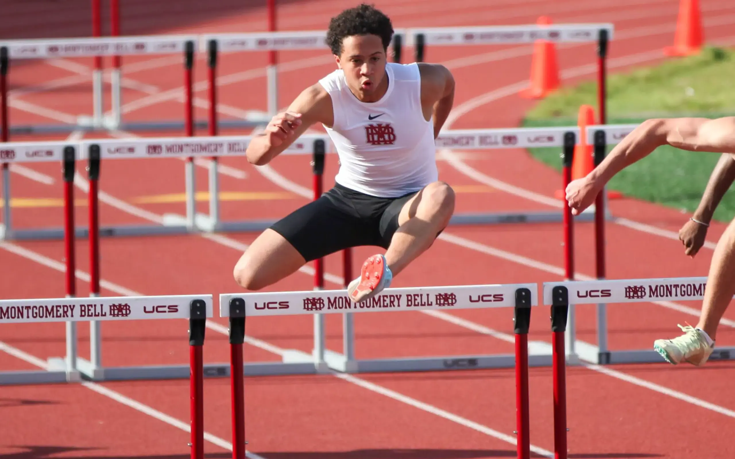 Track runner leaping
