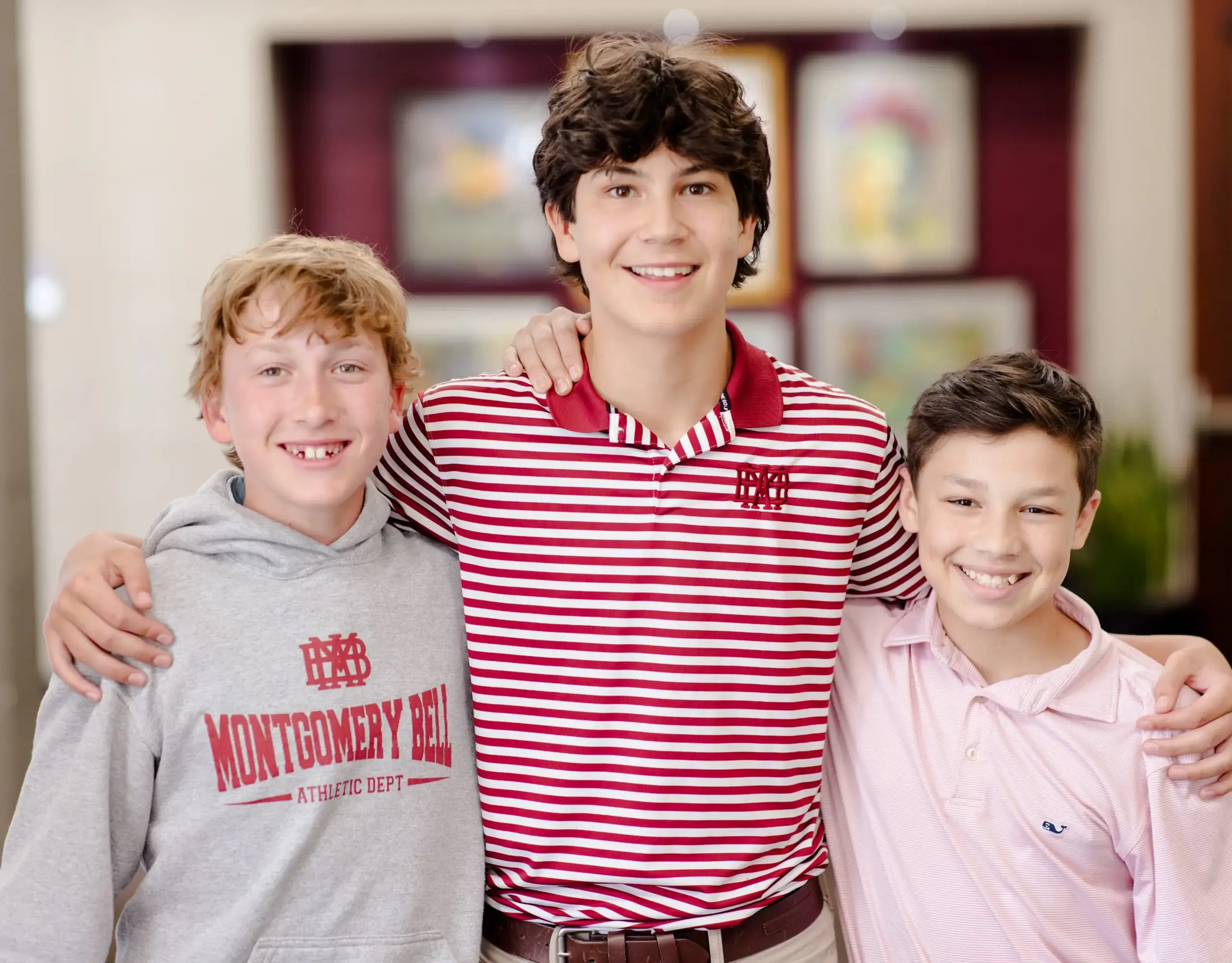 Three students arm-in-arm