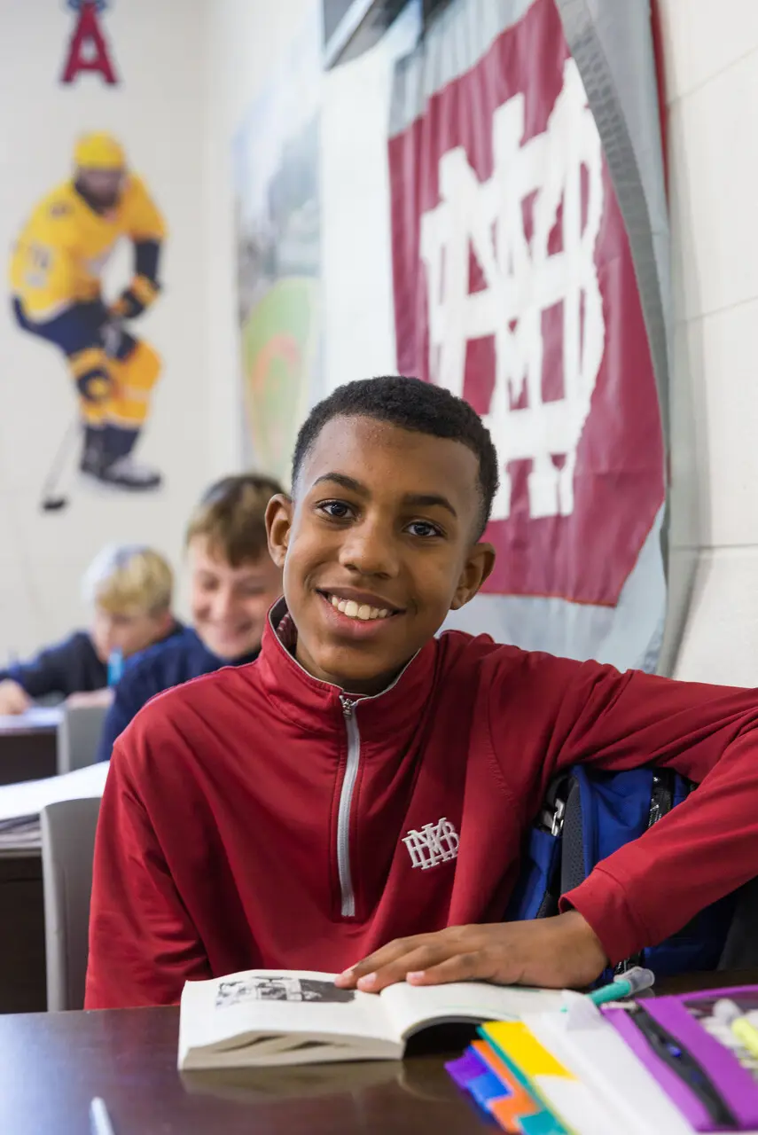 Young boy reading book